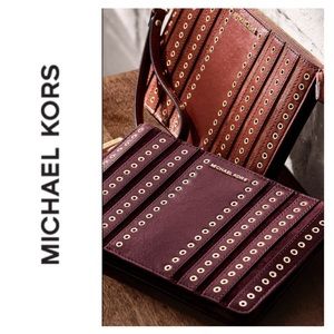 Michael Kors Brooklyn suede grommet clutch in brown